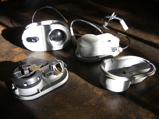 All three light assemblies, one with the grey rubber cover removed. Map Lights (all 3).JPG